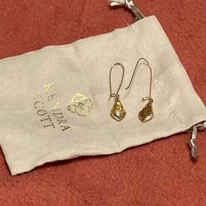 Kendra Scott drop earrings in filigree and peach.